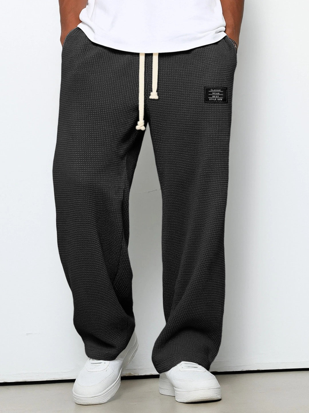 Back view: Men's relaxed fit sweatpants, comfortable and stylish for all-day casual wear.