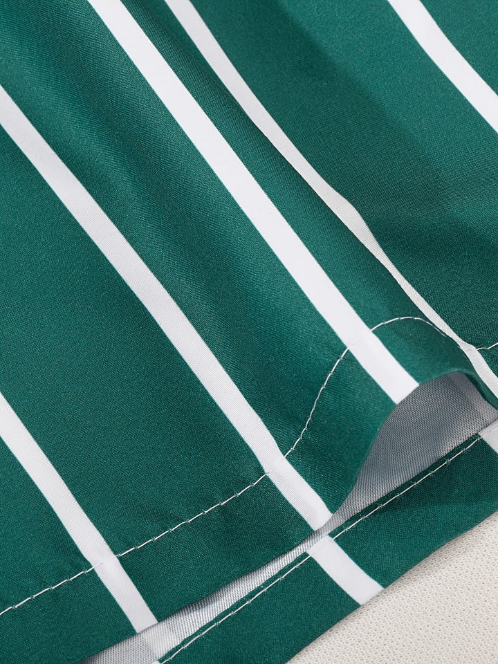 Men's vacation-ready striped swim shorts with drawstring waist, ideal for tropical travel.
