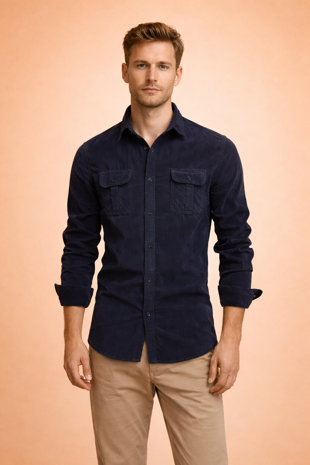 Fashionable men's button-down shirt featuring long sleeves & practical chest pockets. Ideal for a smart casual look.