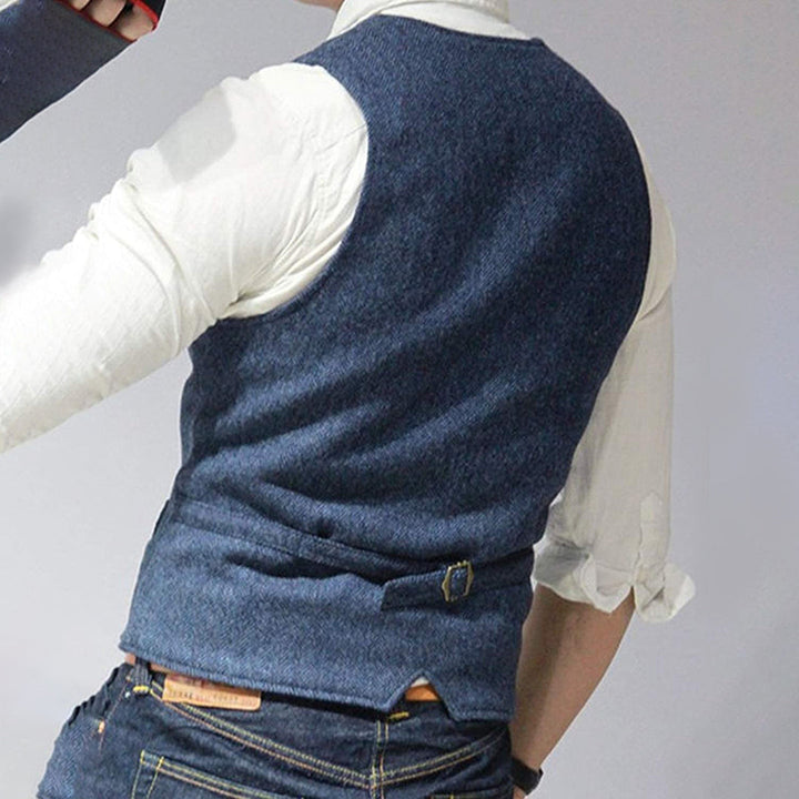 Blue button-front men's denim vest, Mason, a versatile sleeveless jacket for casual fashion outfits.