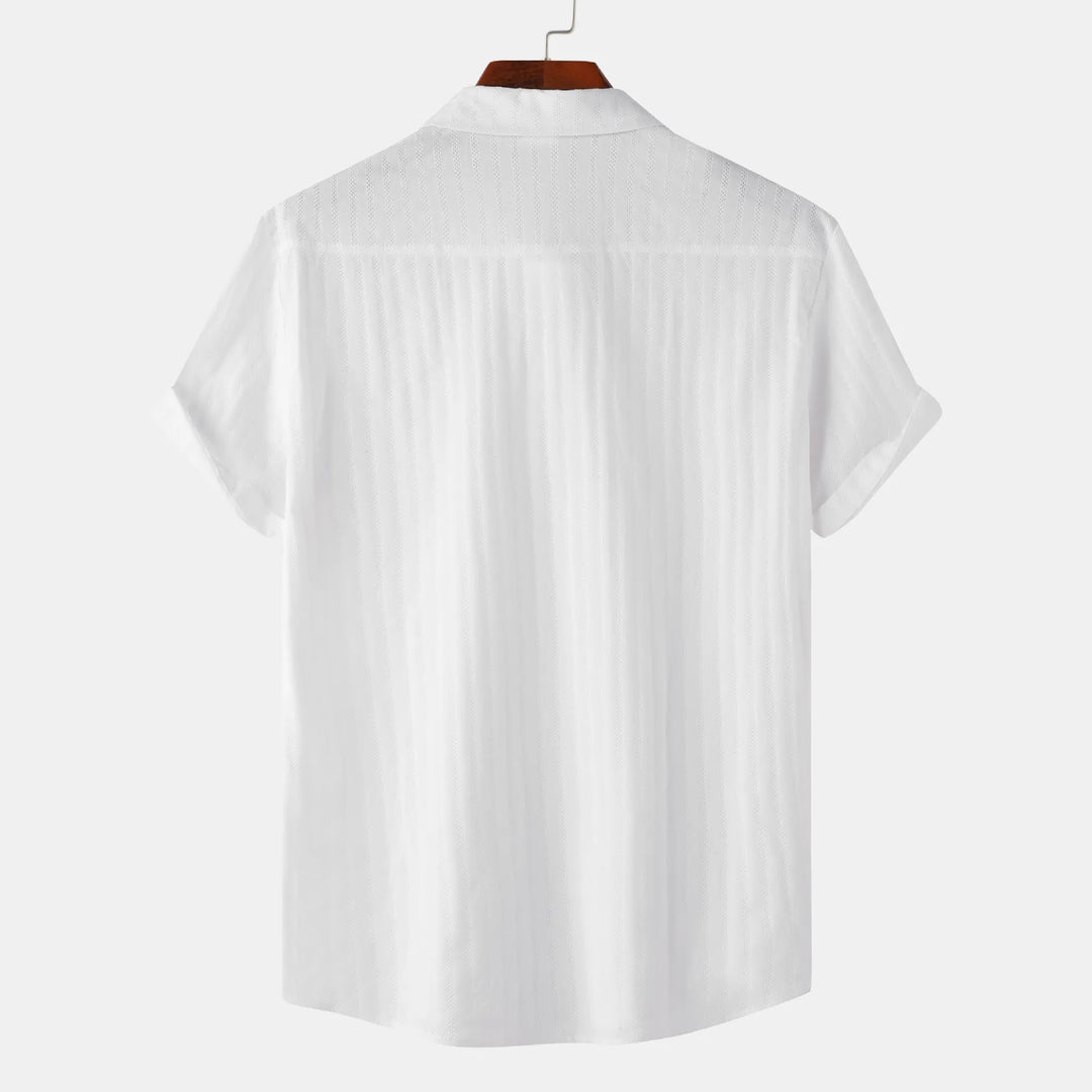 Purple men's short sleeve collared shirt. Stylish button-down for summer fashion.