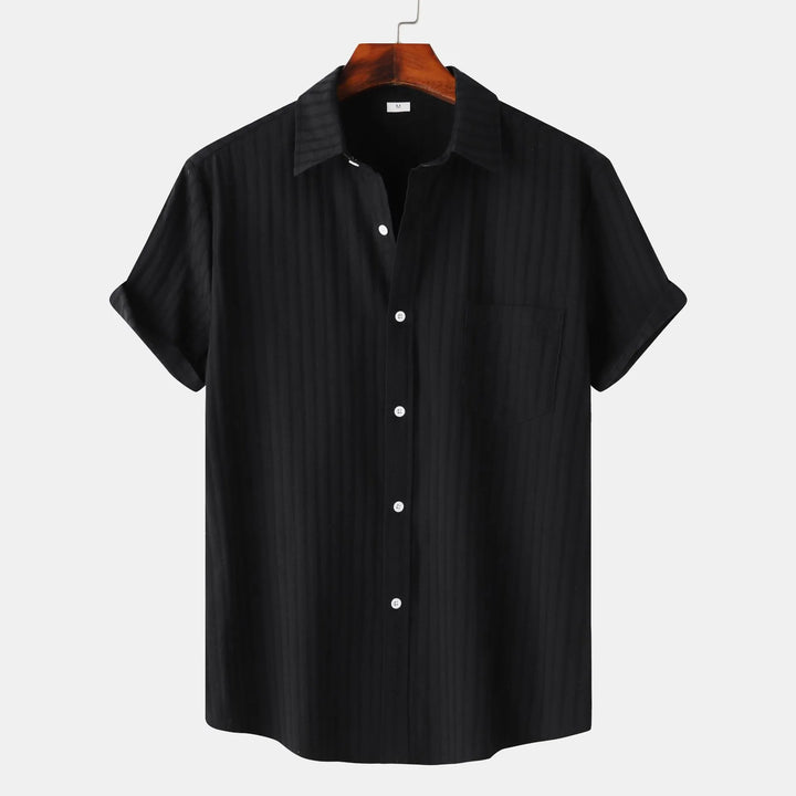 Men's casual short sleeve button-down shirt. Relaxed fit, perfect for everyday summer style.