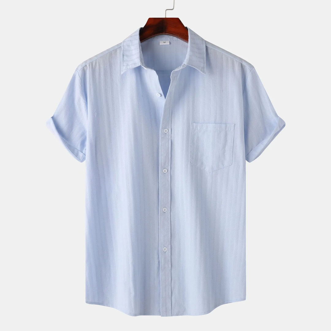 Stylish men's button-down shirt. Short sleeve, versatile for casual & smart summer looks.