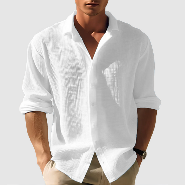 Men's casual button-down shirt, sleek design, versatile for casual or semi-formal wear, shown in light blue fabric.