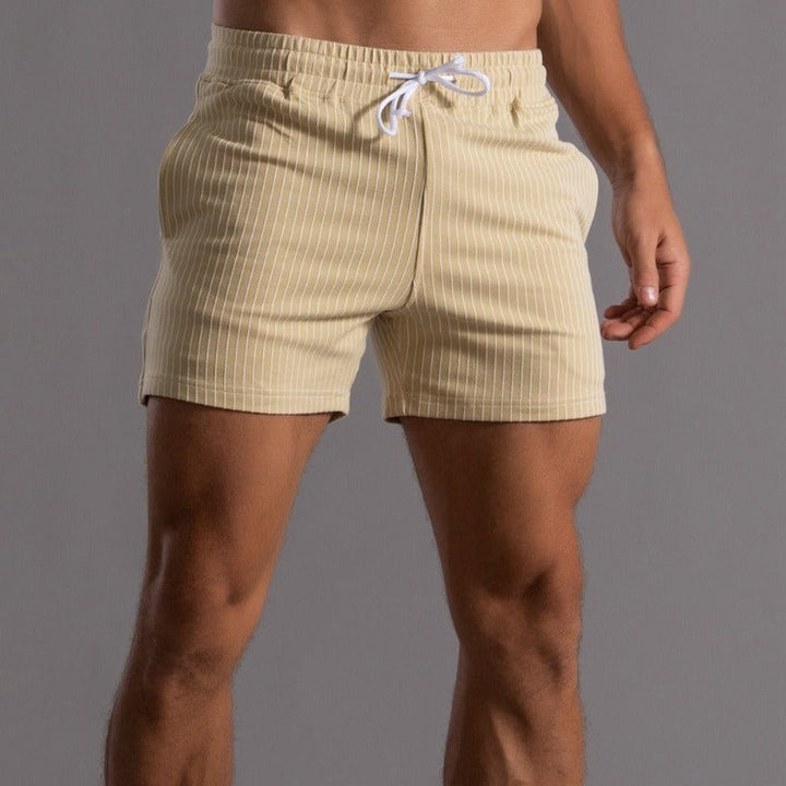 Men's casual striped shorts in yellow, showcasing a modern striped pattern and relaxed fit.
