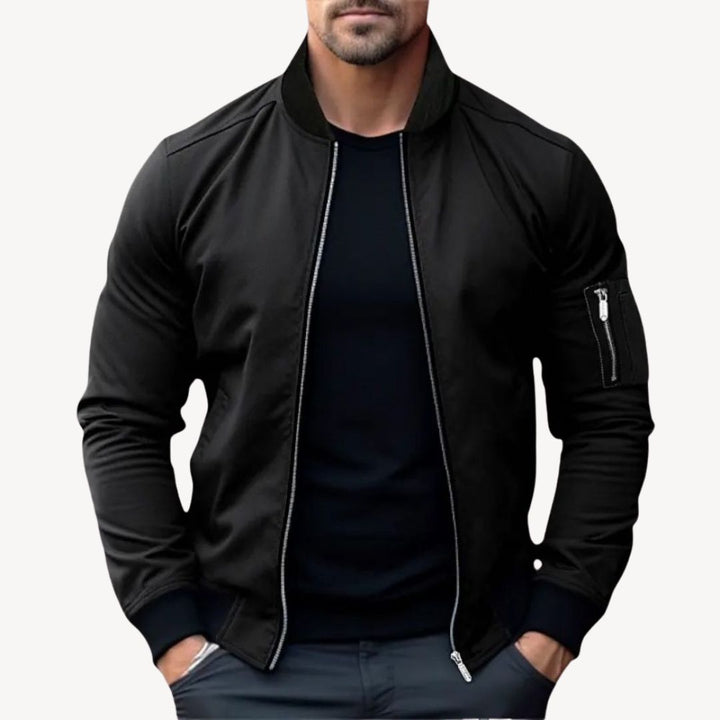 Men's classic zip-up bomber jacket with ribbed details, polyester fabric, versatile for layering, displayed front view.