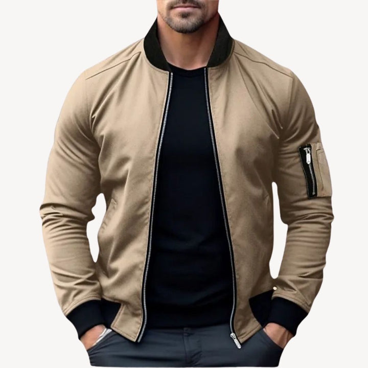 Men's classic zip-up bomber jacket with ribbed details, polyester fabric, versatile for layering, displayed front view.