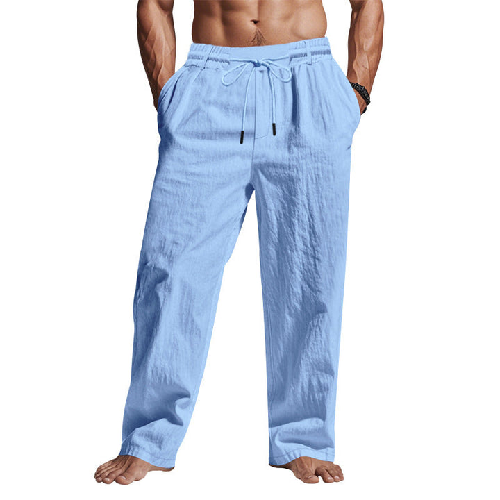 "Men's comfortable linen trousers with drawstring, relaxed fit, breathable fabric, side pockets, ideal for warm days."