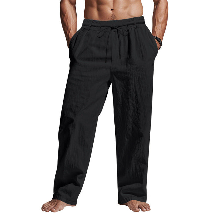 "Men's comfortable linen trousers with drawstring, relaxed fit, breathable fabric, side pockets, ideal for warm days."