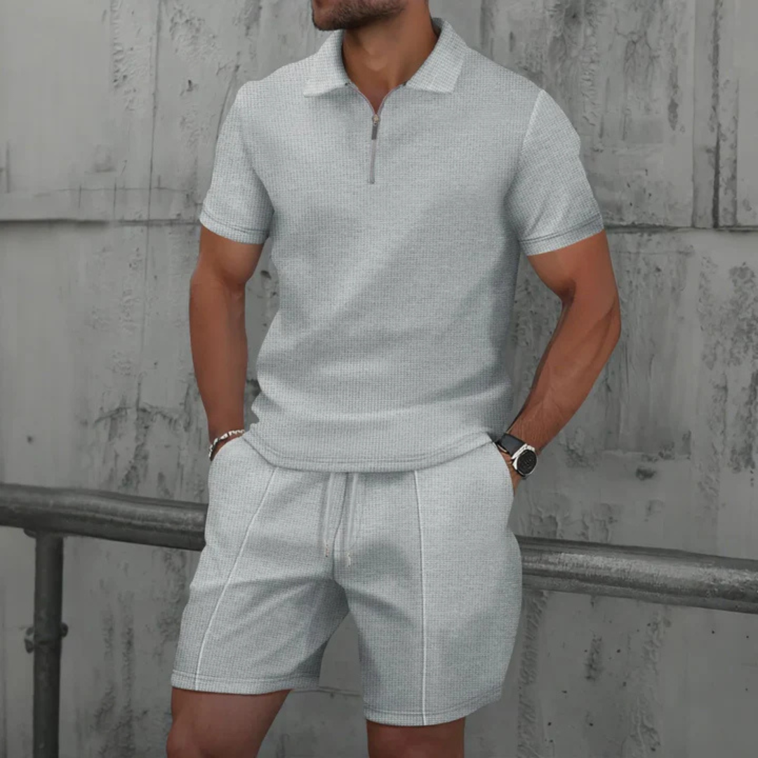 "Men's cotton co-ord set with a short-sleeved zip-neck polo and drawstring shorts, perfect for casual summer style."