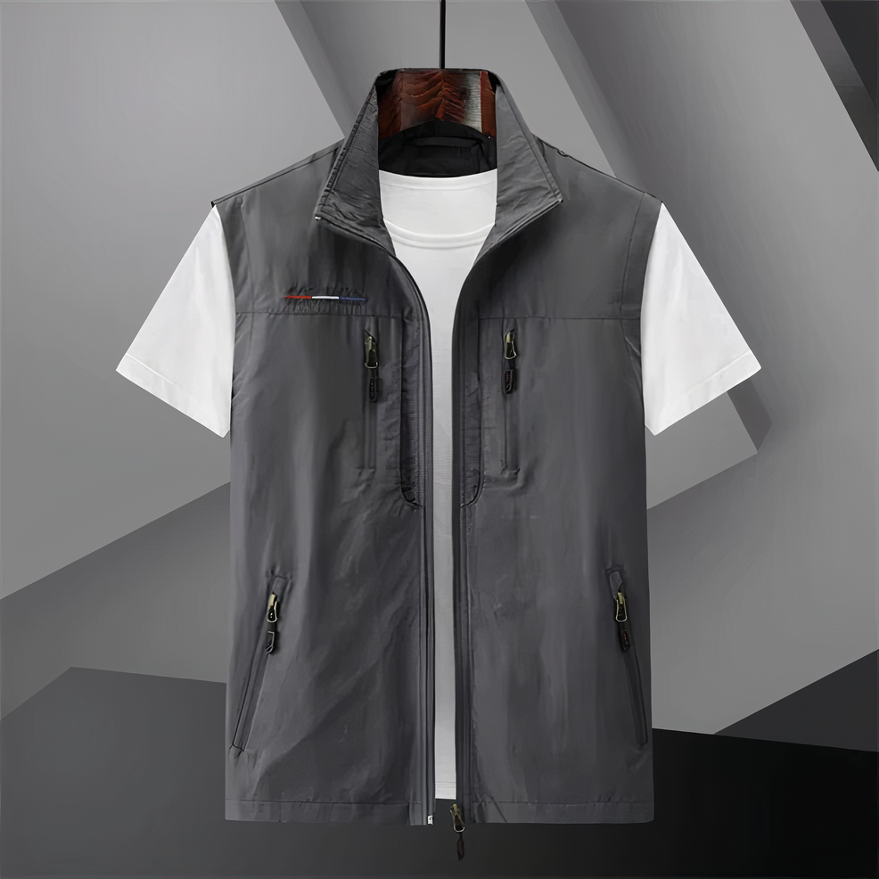 Men's cotton utility vest with multi-pockets, shown in black; ideal for outdoor activities like hiking and fishing.