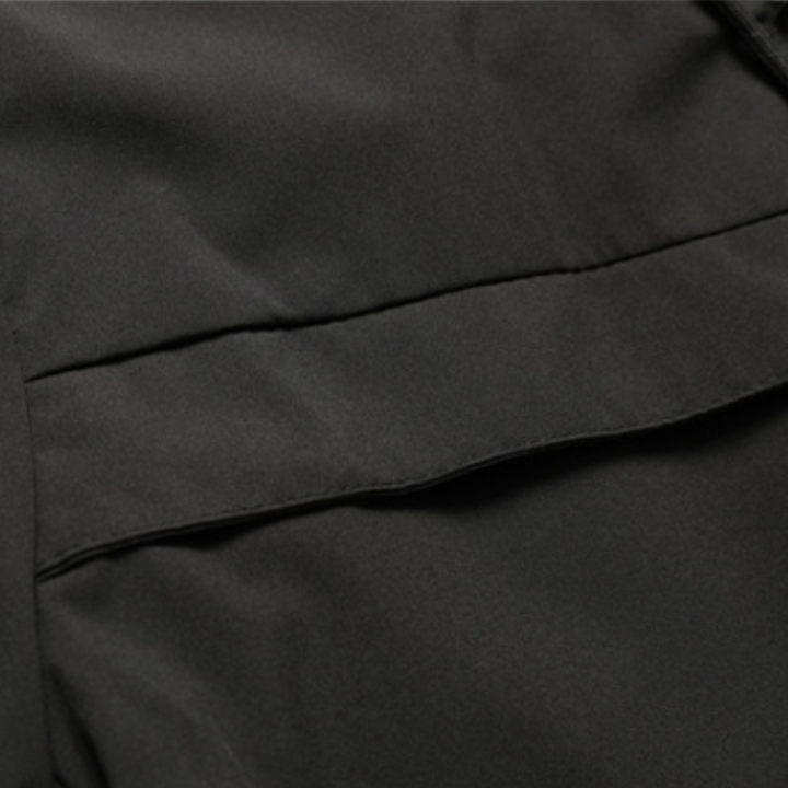 "Men's green waterproof hooded jacket for stylish and durable outerwear. Features sleek design and multi-pocket functionality