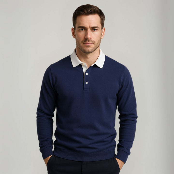 "Men's navy cotton long-sleeve polo sweater with classic design and contrasting collar, perfect for casual or formal wear."