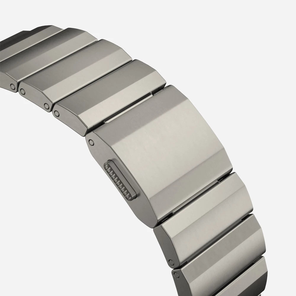 Men's sleek titanium watch band with shiny finish, magnetic clasp, durable and lightweight; perfect for daily or formal wear.