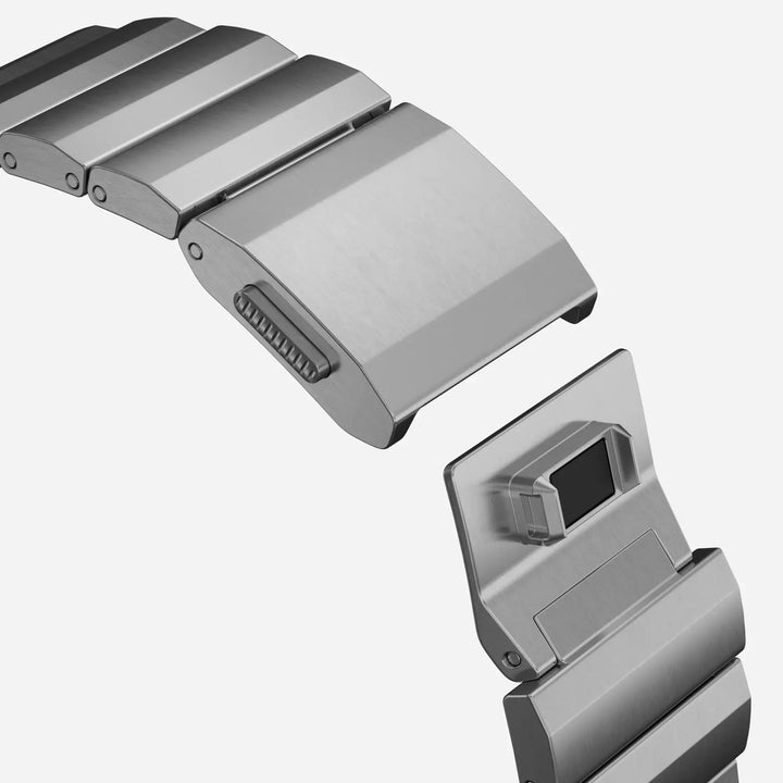 Men's sleek titanium watch band with shiny finish, magnetic clasp, durable and lightweight; perfect for daily or formal wear.