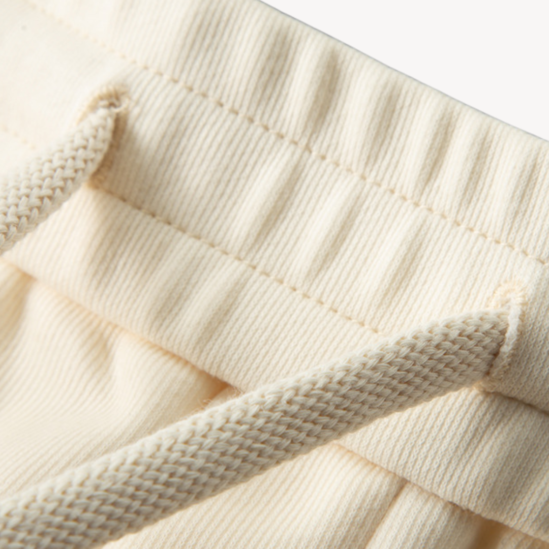 Men's stylish cotton tracksuit set with zip-up hoodie and joggers in neutral colors; perfect for casual wear and lounging.