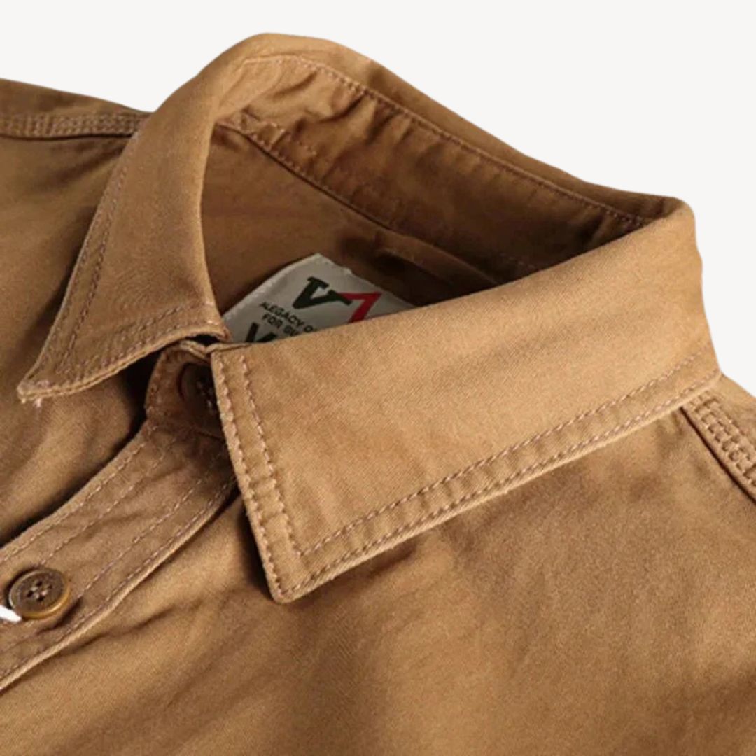 "Men's washed cotton cargo work shirt with pockets, in classic blue, featuring two chest pockets and durable stitching."