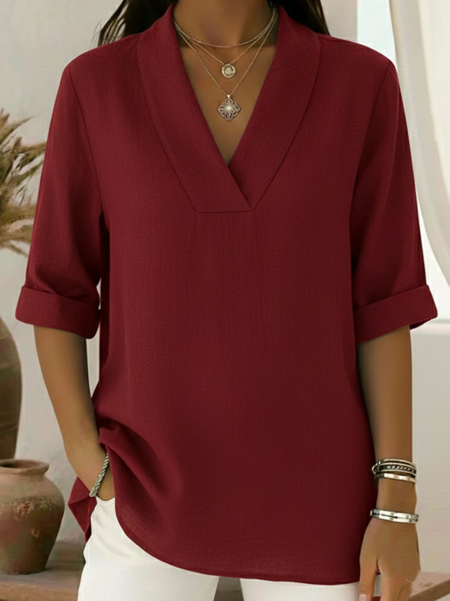 Women's effortless V-neck roll sleeve tunic top in a relaxed fit. Perfect smart casual blouse for everyday wear.