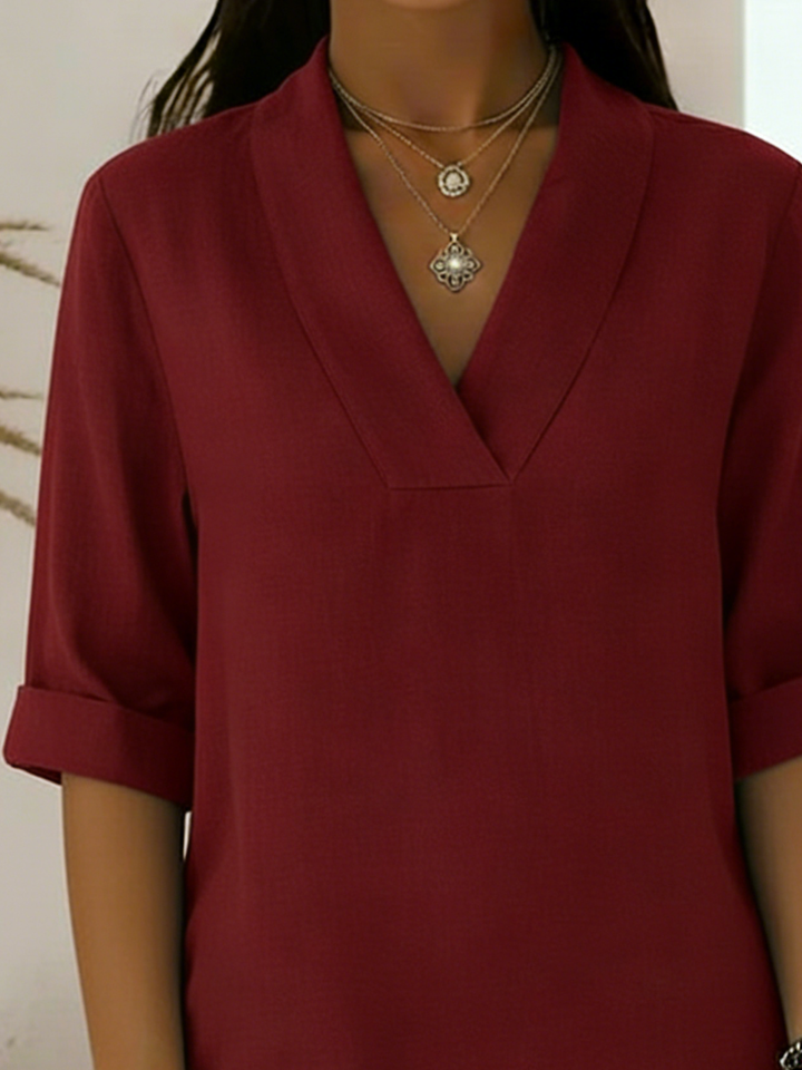 Versatile women's V-neck tunic shirt with roll sleeves for spring & summer. Ideal office wear or casual top.