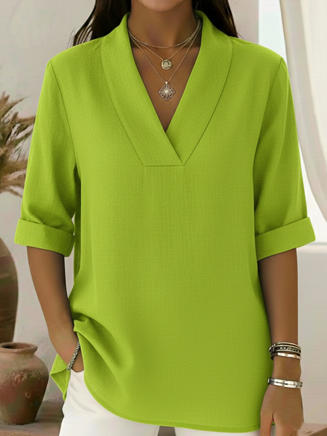 Effortless women's V-neck tunic blouse with roll sleeves, offering comfort & style for office or casual wear.