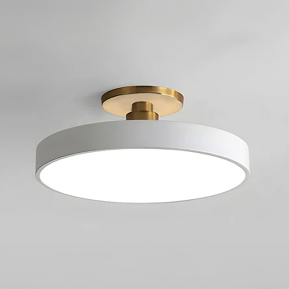 "Minimalist LED ceiling light, semi-flush design, brightens spaces with elegant style and energy-efficient glow."