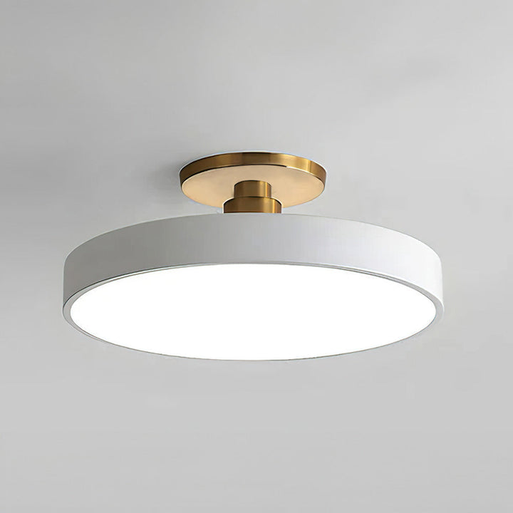 "Minimalist LED ceiling light, semi-flush design, brightens spaces with elegant style and energy-efficient glow."