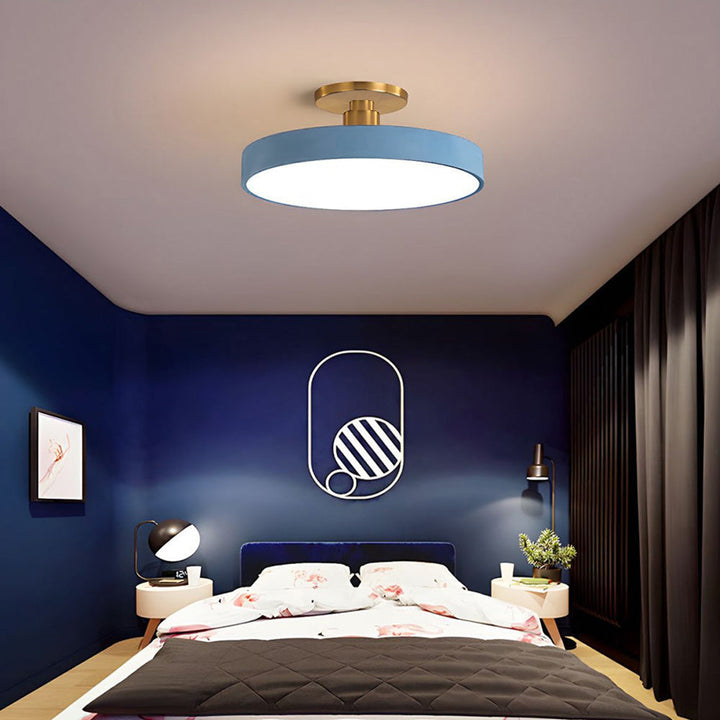 "Minimalist LED ceiling light, semi-flush design, brightens spaces with elegant style and energy-efficient glow."