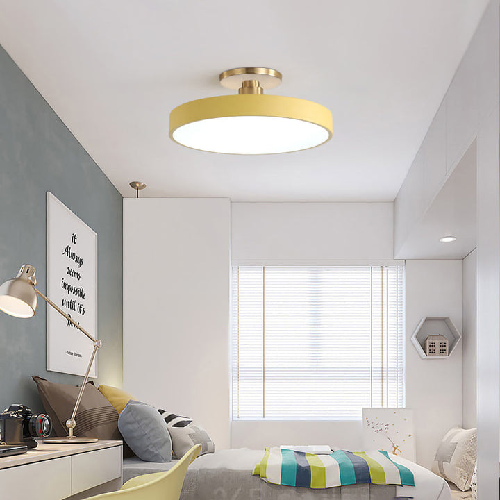 "Minimalist LED ceiling light, semi-flush design, brightens spaces with elegant style and energy-efficient glow."