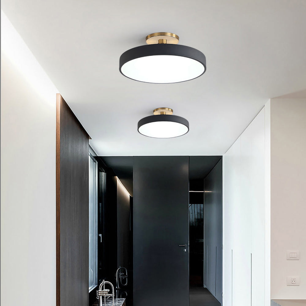 "Minimalist LED ceiling light, semi-flush design, brightens spaces with elegant style and energy-efficient glow."