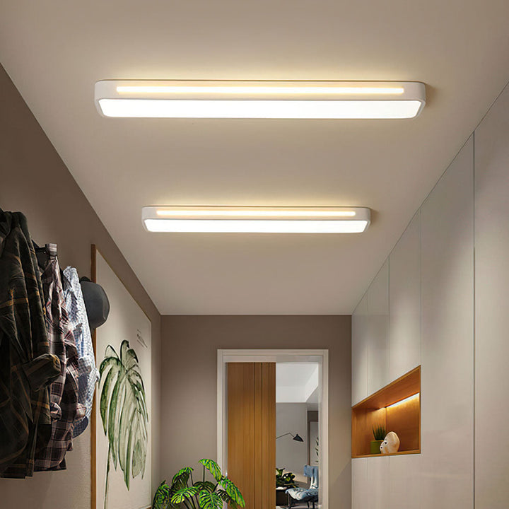 "Minimalist Nordic long LED ceiling light with sleek black finish and modern design for elegant interior lighting"
