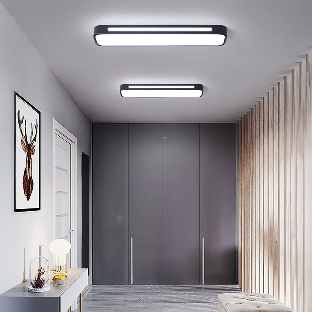 "Minimalist Nordic long LED ceiling light with sleek black finish and modern design for elegant interior lighting"