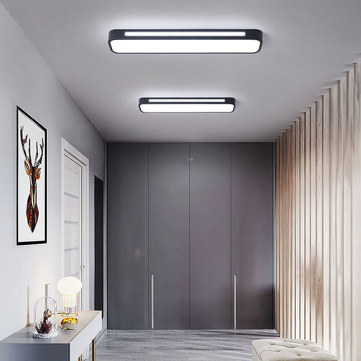 "Minimalist Nordic long LED ceiling light with sleek black finish and modern design for elegant interior lighting"