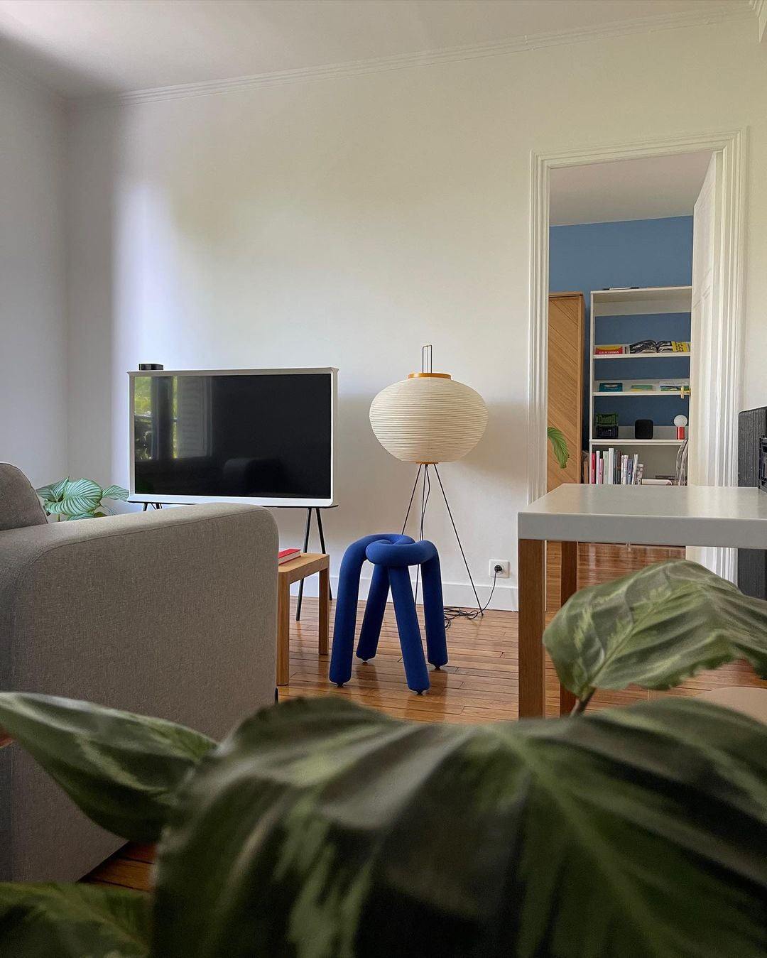 "Minimalist rice paper floor lamp with sleek metal frame and soft diffused light, perfect for creating a warm ambiance."