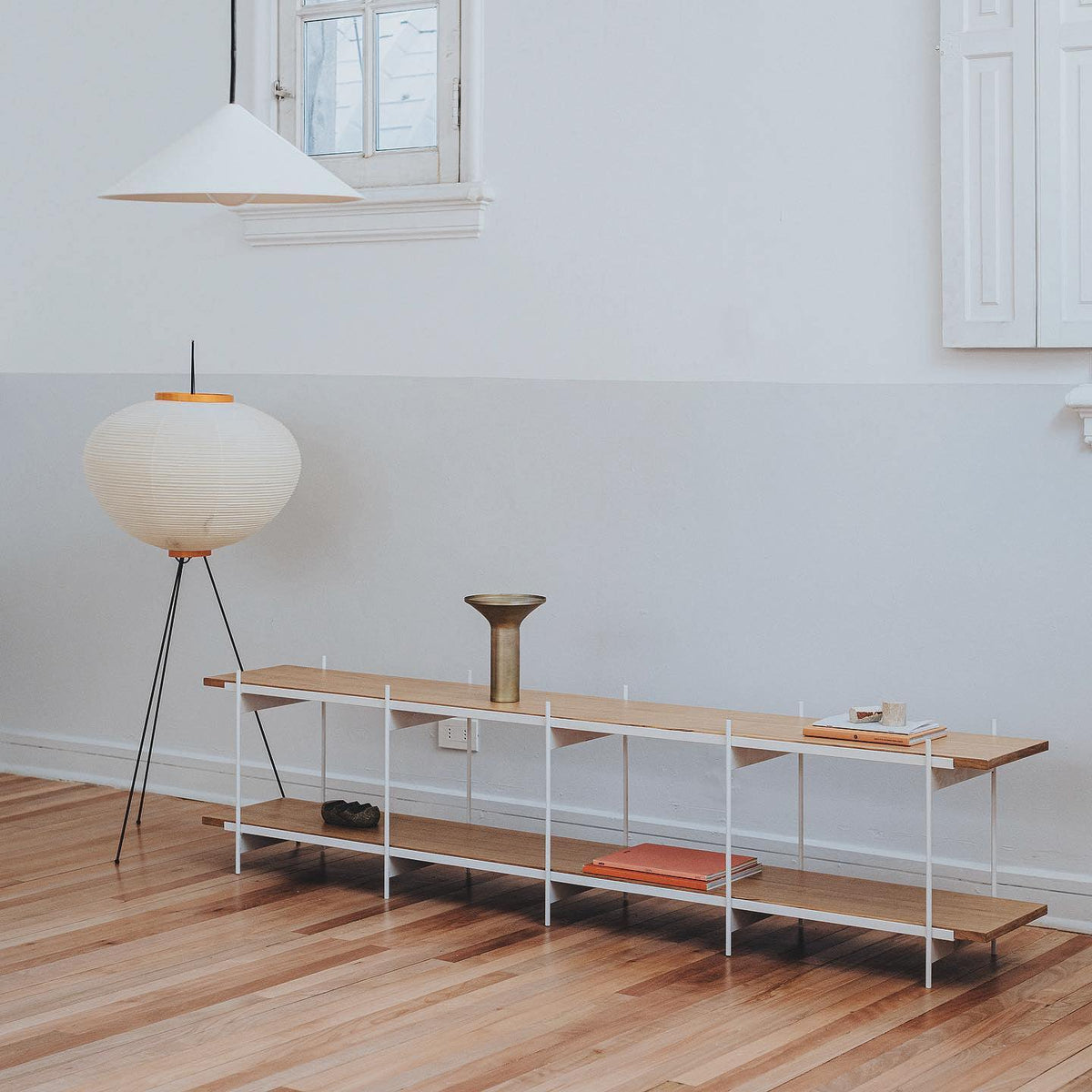 "Minimalist rice paper floor lamp with sleek metal frame and soft diffused light, perfect for creating a warm ambiance."