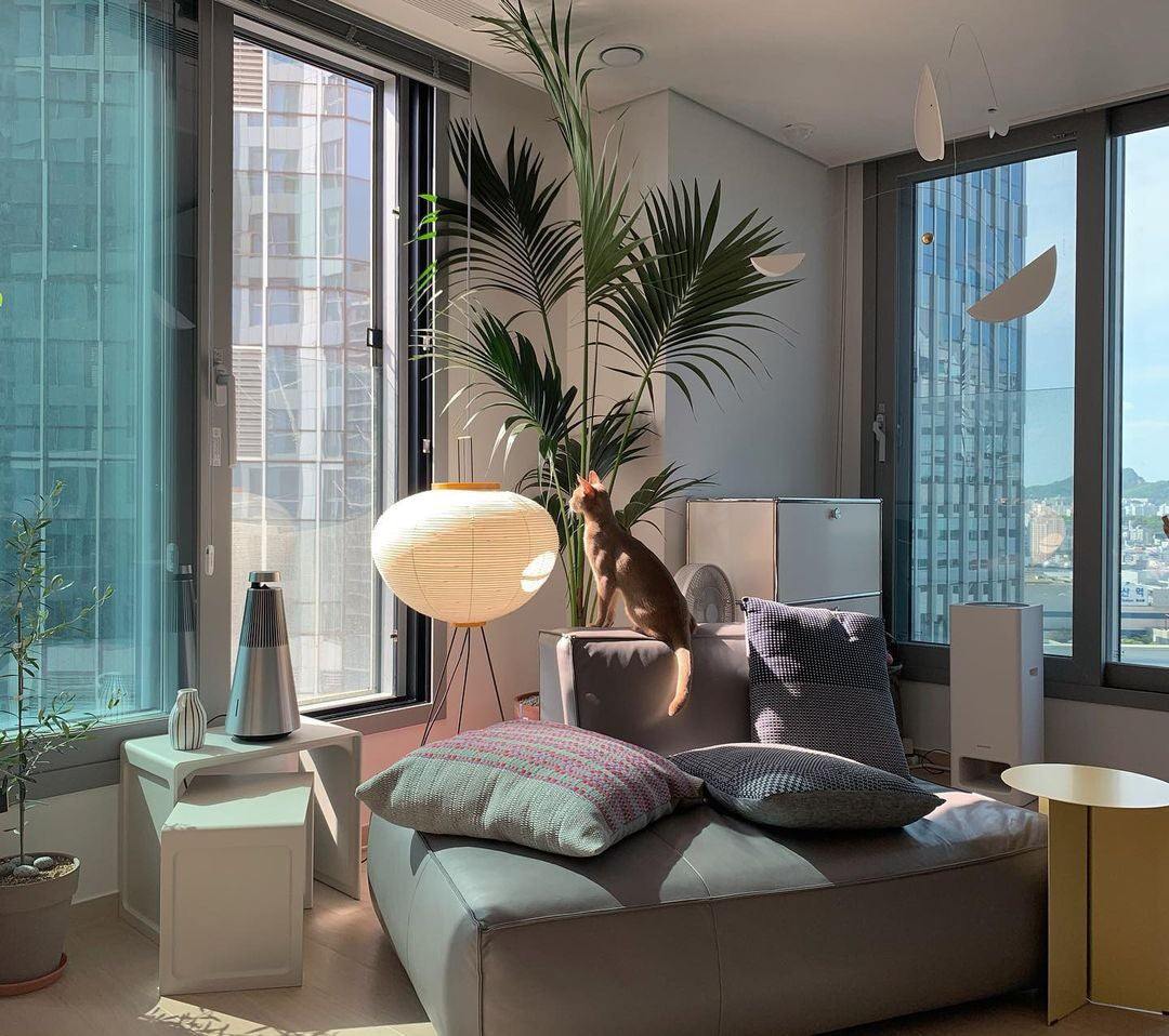 "Minimalist rice paper floor lamp with sleek metal frame and soft diffused light, perfect for creating a warm ambiance."