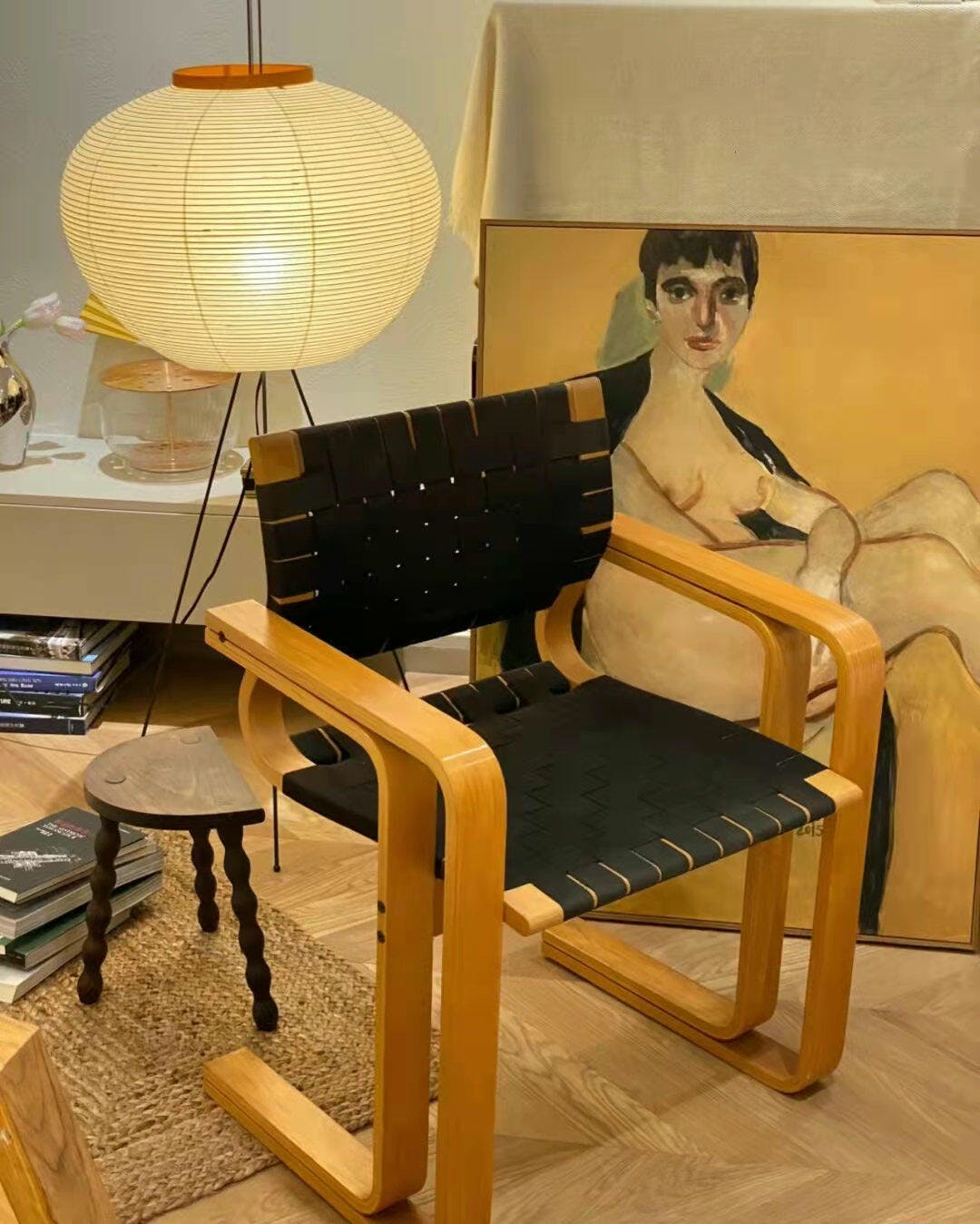 "Minimalist rice paper floor lamp with sleek metal frame and soft diffused light, perfect for creating a warm ambiance."