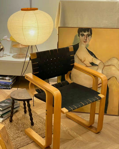 "Minimalist rice paper floor lamp with sleek metal frame and soft diffused light, perfect for creating a warm ambiance."