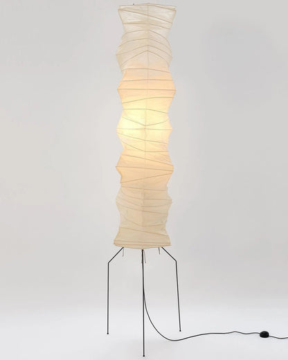 "Minimalist rice paper floor lamp with sleek metal frame and soft diffused light, perfect for creating a warm ambiance."