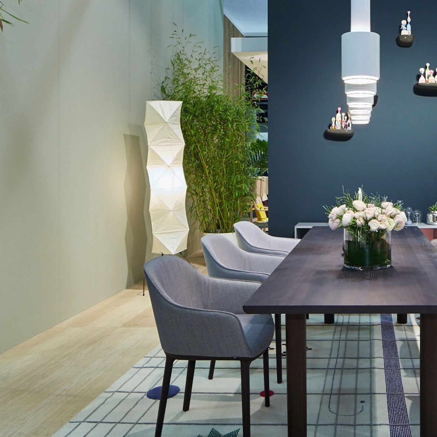 "Minimalist rice paper floor lamp with sleek metal frame and soft diffused light, perfect for creating a warm ambiance."