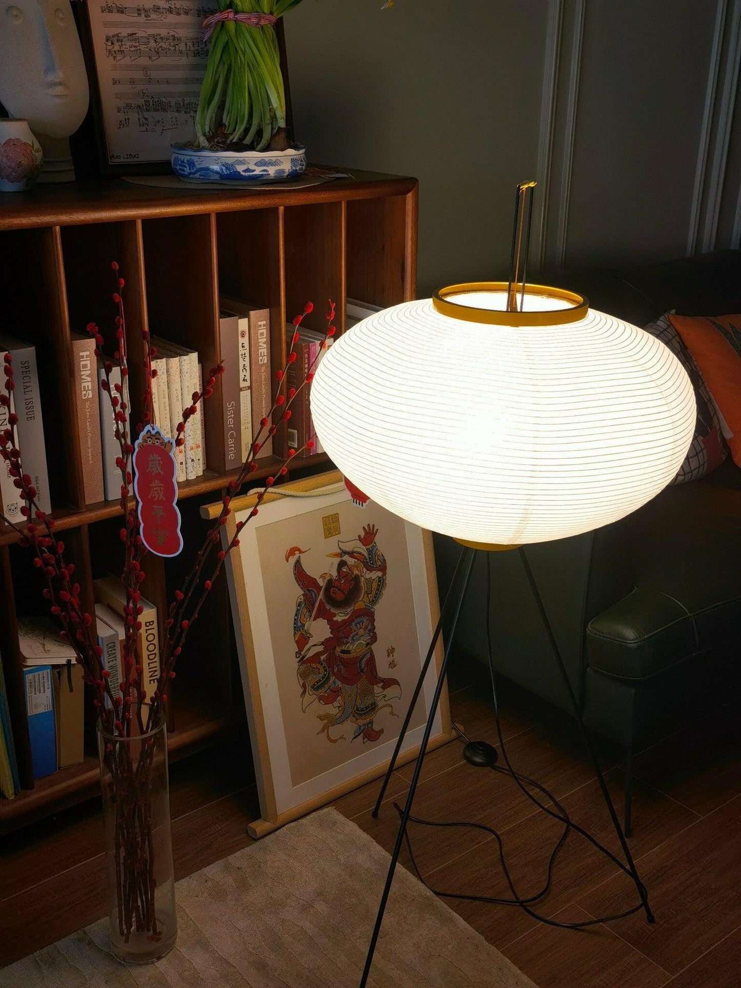 "Minimalist rice paper floor lamp with sleek metal frame and soft diffused light, perfect for creating a warm ambiance."