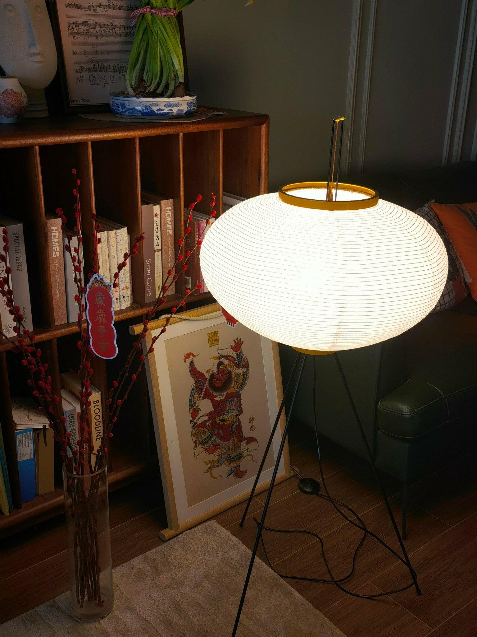 "Minimalist rice paper floor lamp with sleek metal frame and soft diffused light, perfect for creating a warm ambiance."