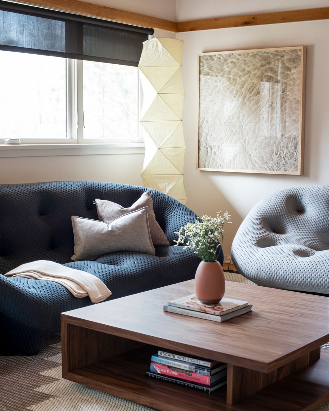 "Minimalist rice paper floor lamp with sleek metal frame and soft diffused light, perfect for creating a warm ambiance."