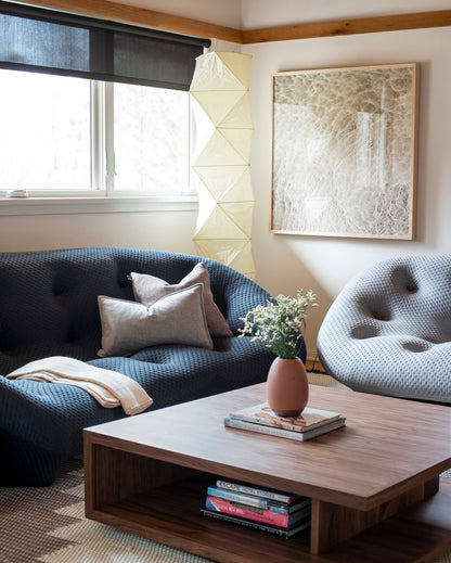 "Minimalist rice paper floor lamp with sleek metal frame and soft diffused light, perfect for creating a warm ambiance."