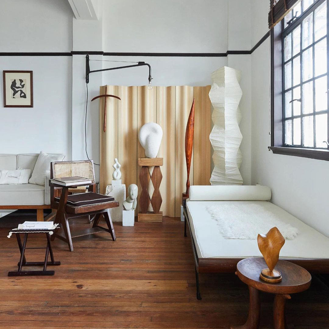 "Minimalist rice paper floor lamp with sleek metal frame and soft diffused light, perfect for creating a warm ambiance."