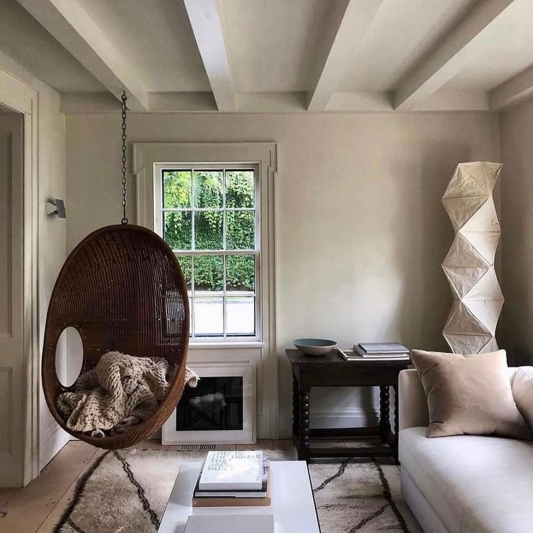 "Minimalist rice paper floor lamp with sleek metal frame and soft diffused light, perfect for creating a warm ambiance."