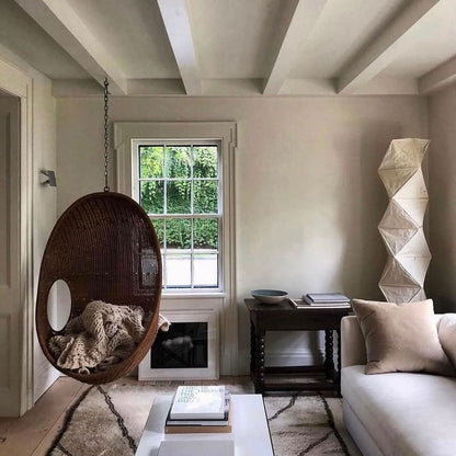 "Minimalist rice paper floor lamp with sleek metal frame and soft diffused light, perfect for creating a warm ambiance."