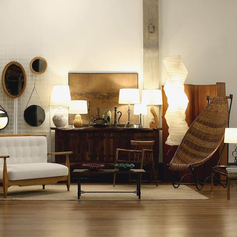 "Minimalist rice paper floor lamp with sleek metal frame and soft diffused light, perfect for creating a warm ambiance."