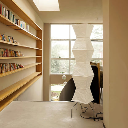"Minimalist rice paper floor lamp with sleek metal frame and soft diffused light, perfect for creating a warm ambiance."