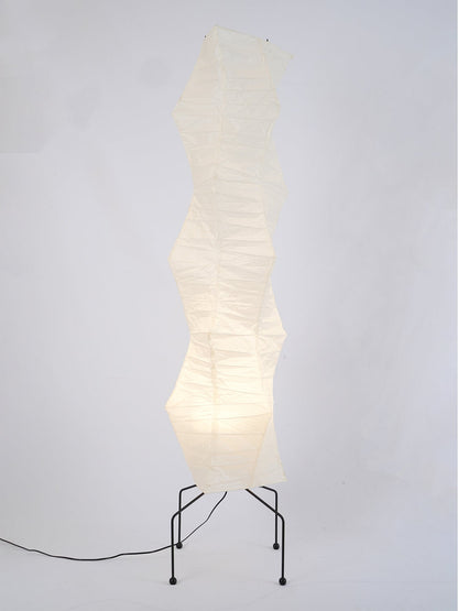"Minimalist rice paper floor lamp with sleek metal frame and soft diffused light, perfect for creating a warm ambiance."