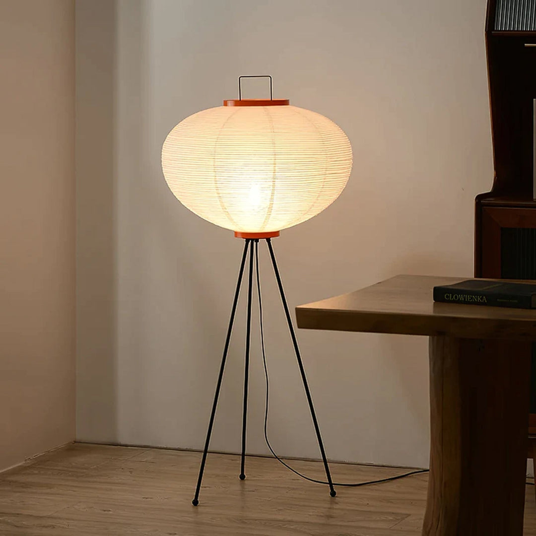 "Minimalist rice paper floor lamp with sleek metal frame and soft diffused light, perfect for creating a warm ambiance."